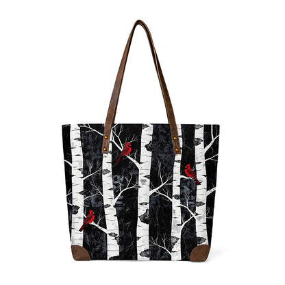 Tote shows red birds on birch branches