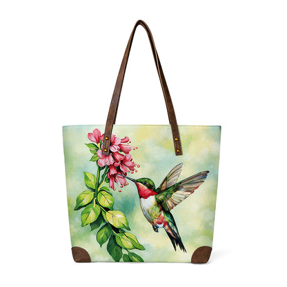 Hummingbird Tote shows bird on blooming flower